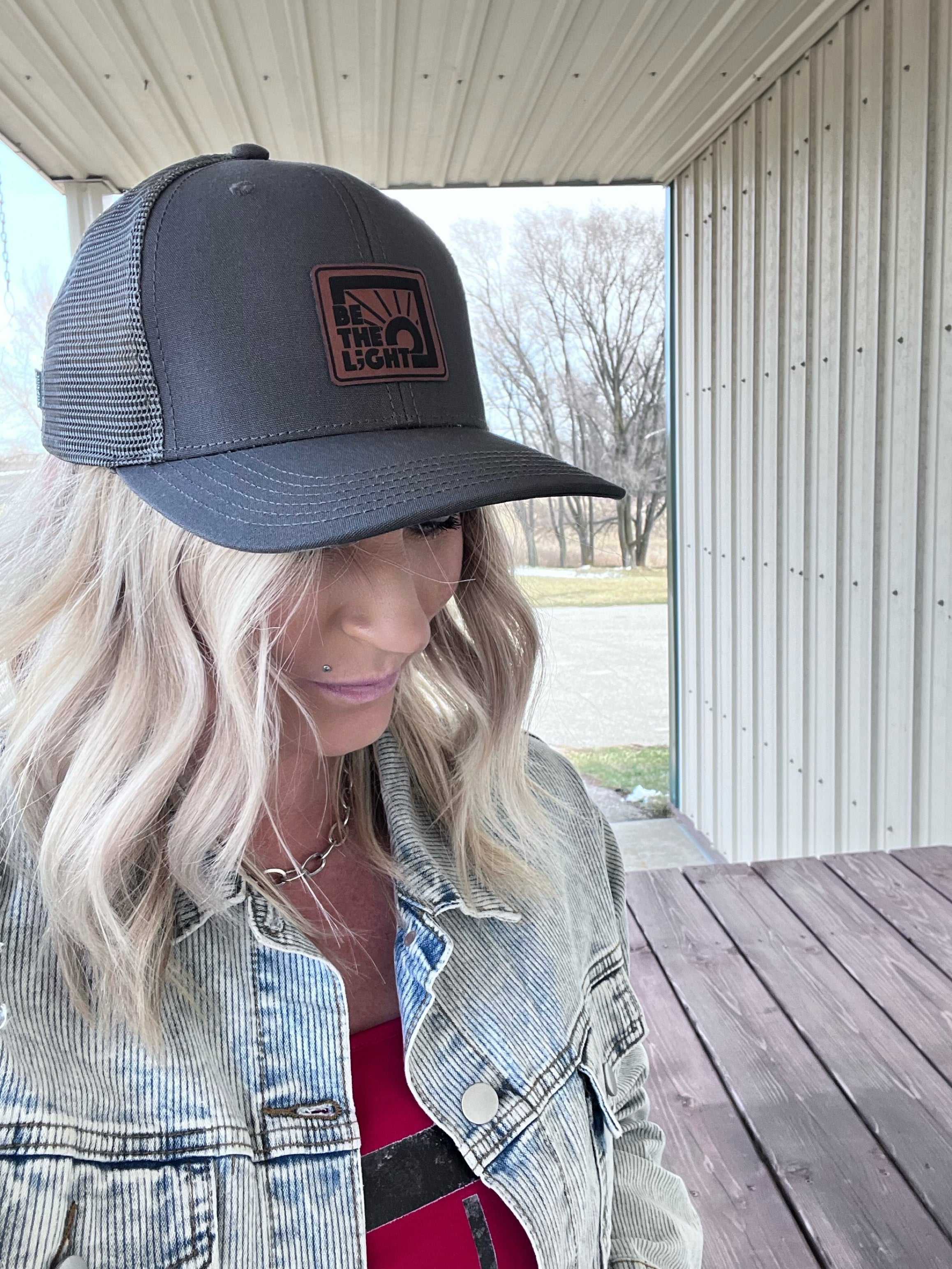 Be the L;ght Trucker Hat in Washed Black